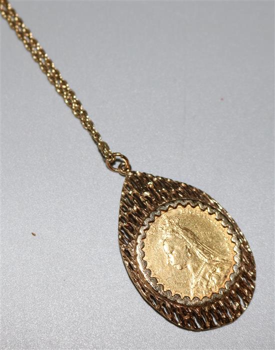 1890 gold sovereign in 9ct gold openwork mount on 9ct gold chain